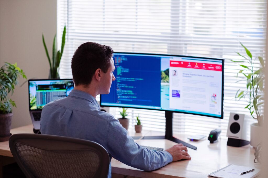 A man uses Telepin's mobile money platform on a desktop.